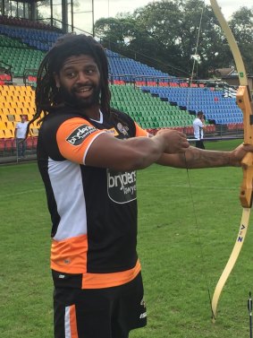 Wests Tigers' Jamal Idris fires a bow and arrow at Concord Oval.