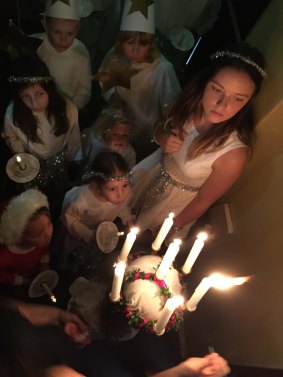 The Scandinavian
Australian Association is on Saturday holding is Scandinvian Christmas Bazaar at Albert Hall. Pictured are children waiting to start the traditional Lucia procession
