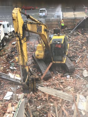 Shaq Demolition knocks down Carlton's historic Corkman Irish Pub. 