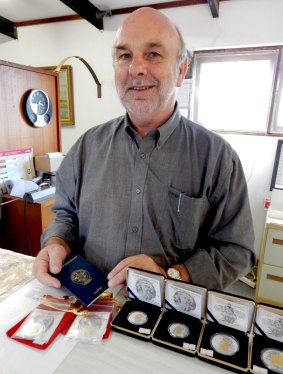 Prince Graeme with a Hutt River passport and merchandise.