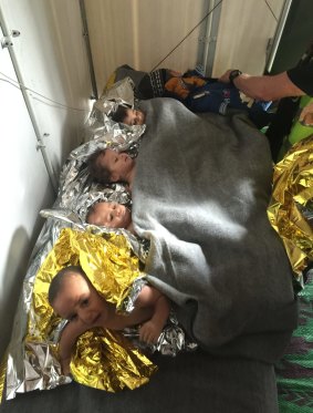 Children being treated for hypothermia after their boat started taking water on the Lesbos coast.