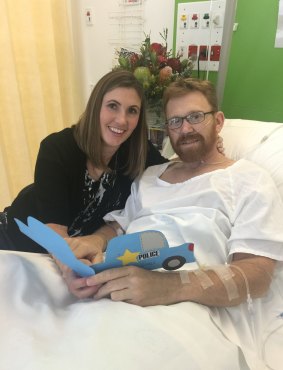Acting Sergeant Luke Warburton, pictured with his wife Sandra, almost died when he was shot in the femoral artery at Nepean Hospital in January 2016.