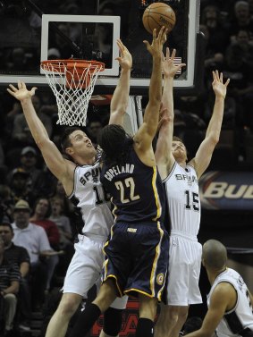Defensive presence: Aron Baynes and Spurs teammate Matt Bonner combine against Indiana's Chris Copeland.