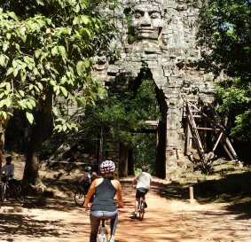 Cycling at Angkor Wat, Cambodia.
