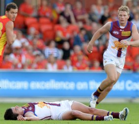 Tom Rockliff is knocked out after colliding with Steven May.