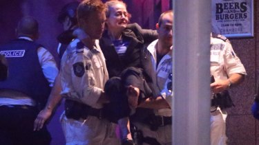 Marcia Mikhael being rescued from the Lindt cafe in Martin Place in Sydney.