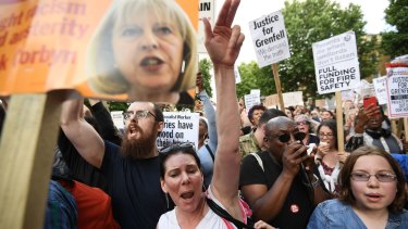 Protesters attend a rally outside Downing Street calling for justice for those affected by the Grenfell Tower fire.