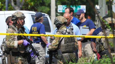 Police and investigators at the scene of the Orlando shooting.