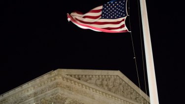 A US flag flies at half-staff in front of the US Supreme Court in Washington after it was announced that Supreme Court Justice Antonin Scalia had died.