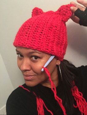 Crystal Howard of New York, showing off the pussy hat. 