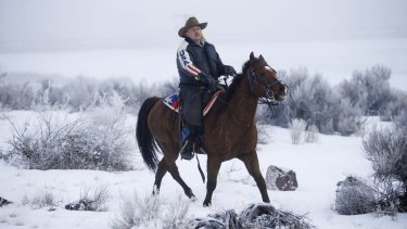 Cowboy Dwane Ehmer, a supporter of the group occupying the Malheur National Wildlife Refuge, rides his horse on Thursday near Burns, Oregon.