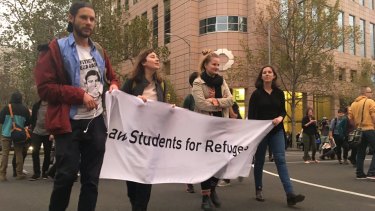 Refugee supporters demonstrate outside the Immigration Department's Melbourne building on Thursday evening.