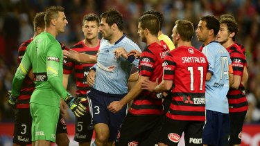 Sydney FC and Wanderers players scuffle during the derby last October.