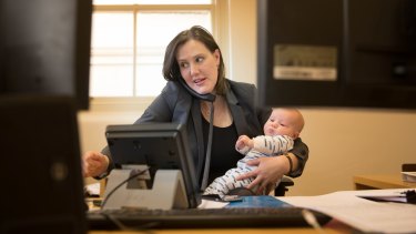 Kelly O'Dwyer at work with her son Edward.