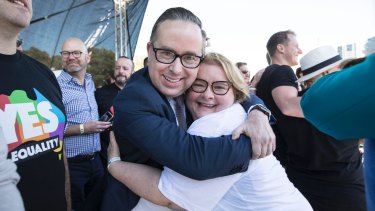 Qantas chief executive officer Alan Joyce hugs Magda Szubanski in Sydney after the result.