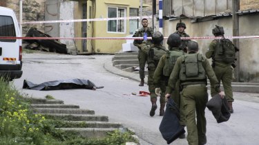 Israeli soldiers near the body of Abdel Fattah Sharif, who was shot and killed by Sergeant Elor Azaria in March. 