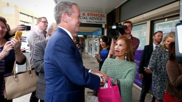 Esther Arador sings <i>Unchained Melody</i> to Opposition Leader Bill Shorten during a street walk in Campbelltown, NSW. 