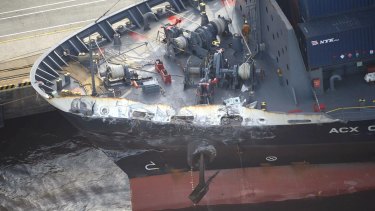 The container ship ACX Crystal with its left bow dented after colliding with the USS Fitzgerald in the waters off the Izu Peninsula, Japan.