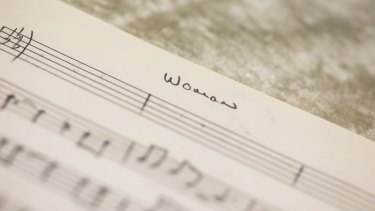 The hand written song 'Woman' is displayed at the police department headquarters in Berlin on Tuesday.