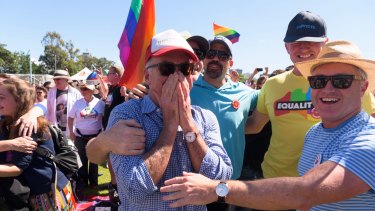 Same-sex marriage supporters react to the "yes" result at Prince Alfred Park in Surry Hills, Sydney.