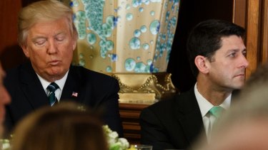 US President Donald Trump sits with House speaker Paul Ryan during a "Friends of Ireland" luncheon on Capitol Hill  on March 16.
