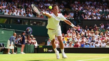 Overpowered ... Bernard Tomic of Australia stretches for a forehand during his third-round loss to Novak Djokovic.