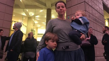 Nicky Forster with her two children, Buckley and Flora.
"I'm here to teach my children, the next generation, that this is wrong."