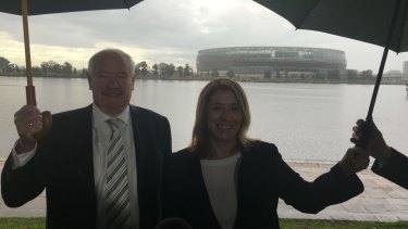 It's raining rugby. Sports Minister Mick Murray and Transport Minister Rita Saffioti.