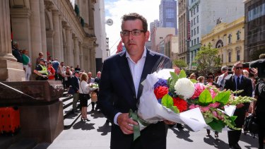 Premier Daniel Andrews lays flowers in the Bourke Street Mall.