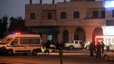 Jordanian police inspect the scene in al-Qatranah where attackers opened fire on policemen, killing two and escaping to Al-Karak where they continued to the Crusader Castle.