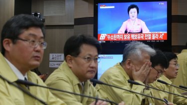 South Korean government officials attend an emergency meeting yesterday
