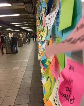 The wall has now spilled onto the columns on the platform at Union Square station.