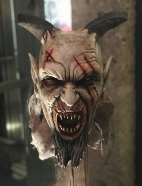 A battle-scarred Krampus mask ready for action at the workshop in Salzburg.