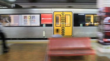 Train commuters use Queensland Rail trains in Brisbane.