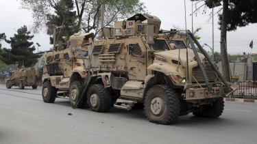 A damaged US military vehicle is pictured at the site of a suicide attack in Kabul, Afghanistan.