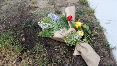 Flowers left at the scene of a motorcycle accident in Queanbeyan where the 22-year-old rider died.