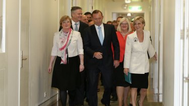 Prime Minister Tony Abbott arrives for the party room meeting at Parliament House.