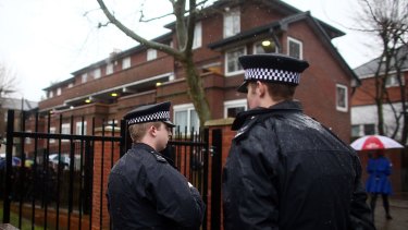 Police officers near the home of Islamic State militant Mohammed Emwazi, popularly known as Jihadi John. 