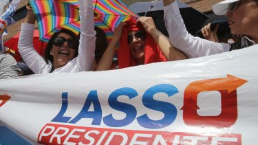 Opposition presidential candidate Guillermo Lasso's supporters protest outside Ecuador's National Electoral Council to demand the official results on Monday.