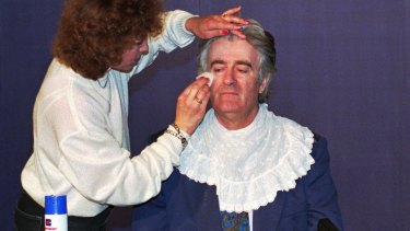 Karadzic gets ready for a live TV appearance in 1995.