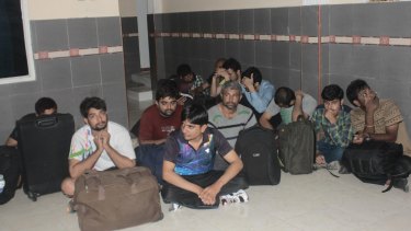 The male asylum seekers, who are from India, Nepal and Bangladesh, at Nusa Tenggara Timur police station.