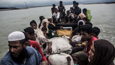 Rohingya refugees arrive by boat from Myanmar, near Teknaf, Bangladesh, in September.