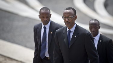 Rwanda's President Paul Kagame, centre, flanked by security personnel, in Kigali last year. 