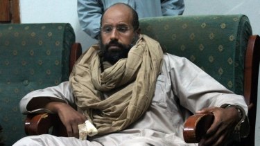 Saif al-Islam Gaddafi, the second son of Libya's dictator, after his capture in November 2011. He predicted civil war if his father's regime was removed.