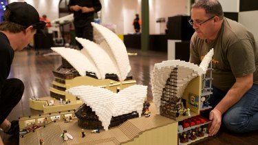 Ryan McNaught (right) and workers set up for the Lego exhibition at Sydney's Town Hall.