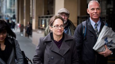 Kathy Clubb, centre, outside the Melbourne Magistrates Court in August.