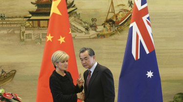 Australian Foreign Affairs Minister Julie Bishop shakes hands with Chinese Foreign Minister Wang Yi during their joint press conference at the Ministry of Foreign Affairs in Beijing.