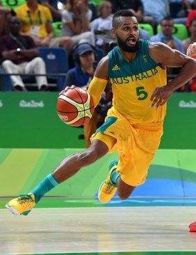 Top of their Games: Patty Mills drives forward for the Boomers. 