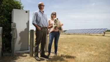 Dominic and Jane Osborne with solar array and battery storage pack.