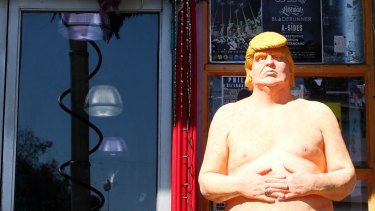 A statue of presidential hopeful Donald Trump is placed outside a shop in Los Angeles. 